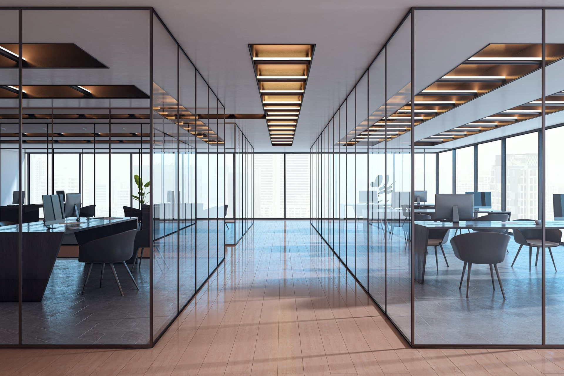 Clean modern office with desks, whiteboards, and visible streaks free glass partitions